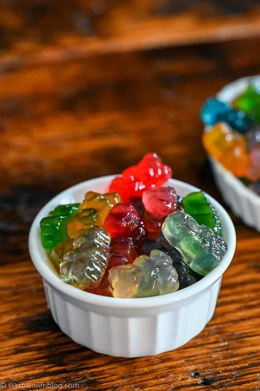 colorful gummy bears in a white ramekin