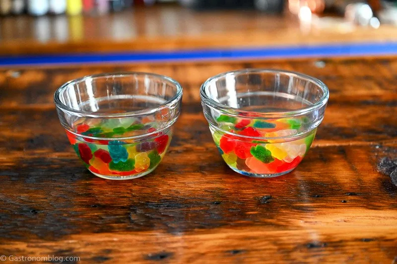 colorful gummy bears in glass bowls