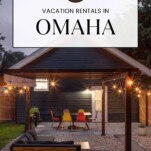 Omaha Vacation Rentals with outside evening picture of a covered patio with sofa, table and chairs, and lights
