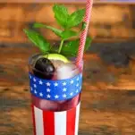 Cherry Mojitos in flag printed glasses with mint and red straws