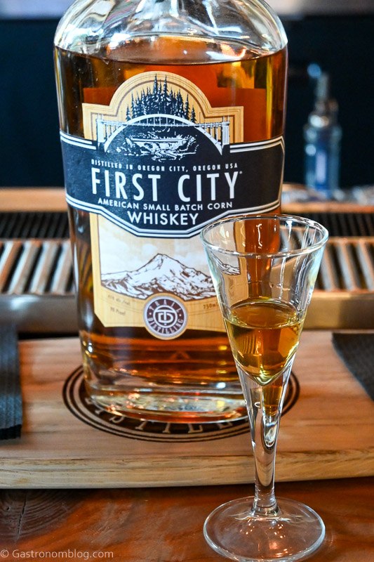 Trail Distilling whiskey bottle and tasting glass