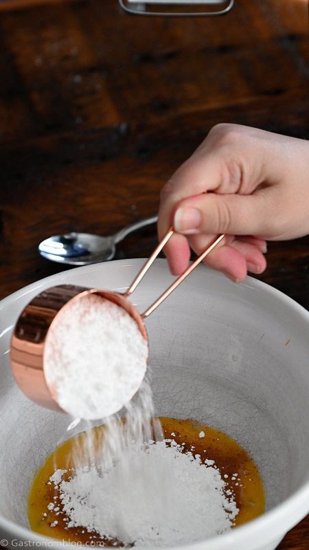 powdered sugar being added into bowl
