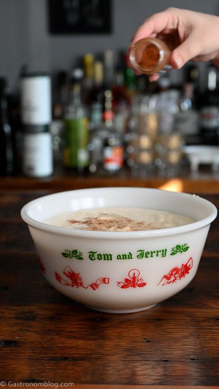 Tom and Jerry Drink in a large ceramic punch bowl, cinnamon added to top