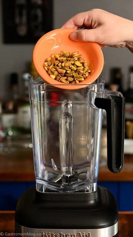 pistachios being poured into blender