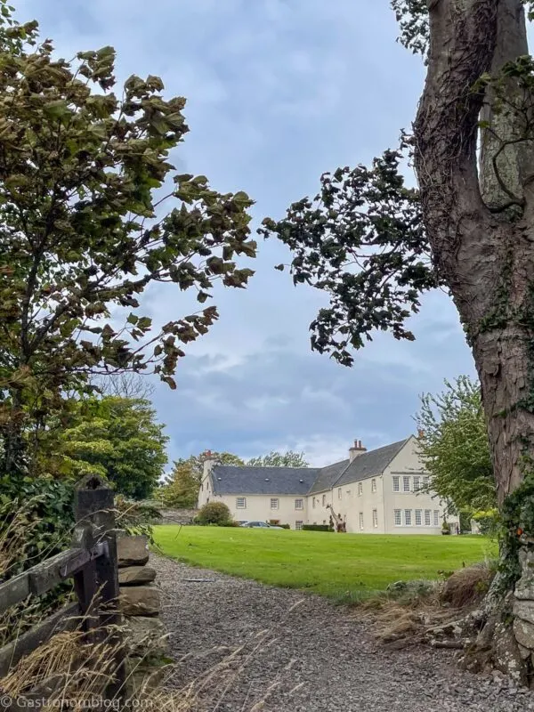 outside of at Glenmorangie House Scotland in the Scottish Highlands Trees around gate to the beach.