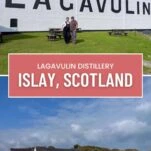 White distillery building at Lagavulin, on the isle of Islay, Scotland. Brick smokestack behind