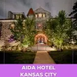 outside of Aida Hotel Kansas City at night, all lit up