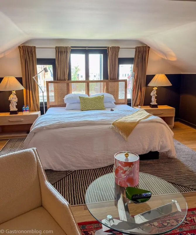 bed in front of windows at Aida Hotel Kansas City