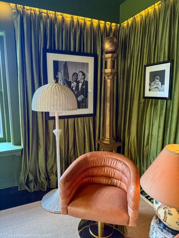 green drapes on walls in sitting room at Aida Hotel Kansas City