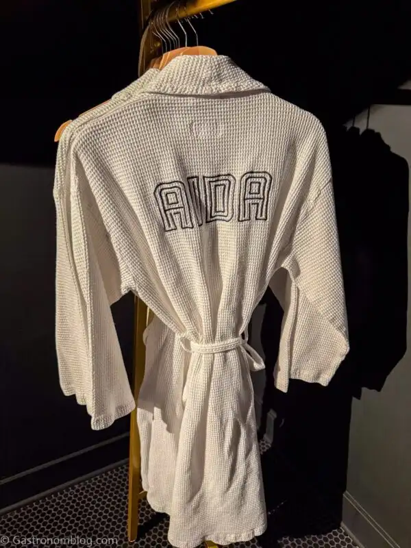 white robes with black print at Aida Hotel Kansas City