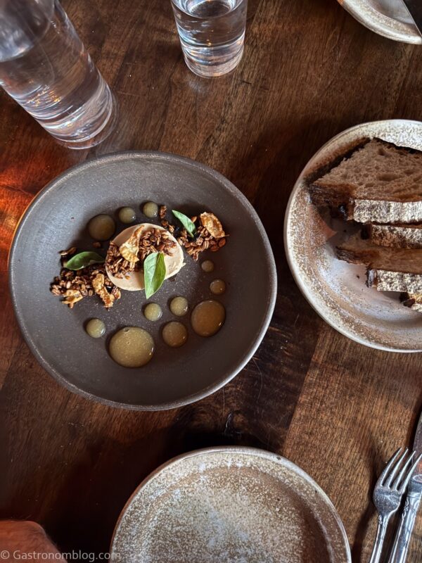 overhead shot of foie gras on gray plate and side plate of bread at Fox & Pearl Kansas City
