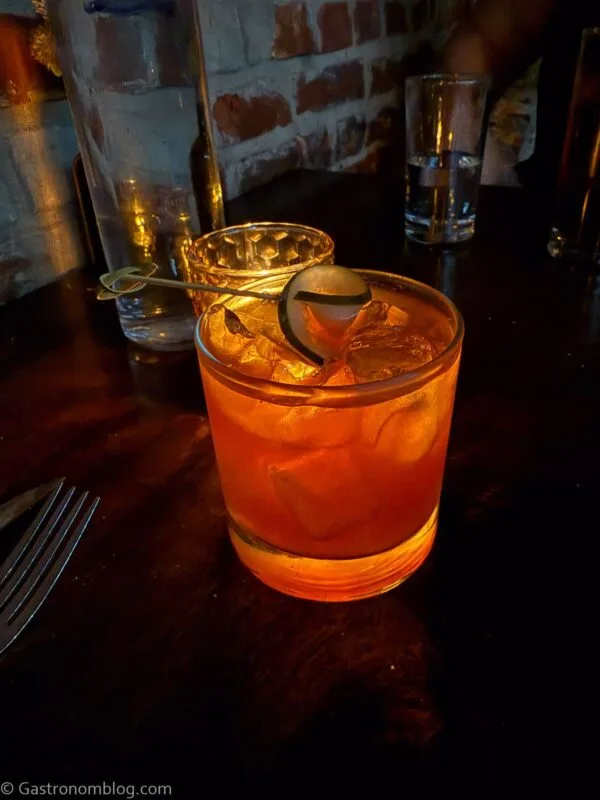orange cocktail in rocks glass with ice at Fox & Pearl Kansas City