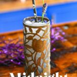 Midnight Margaritas in Metal chased floral tumblers with skull straw, lavender garnishes on wooden table