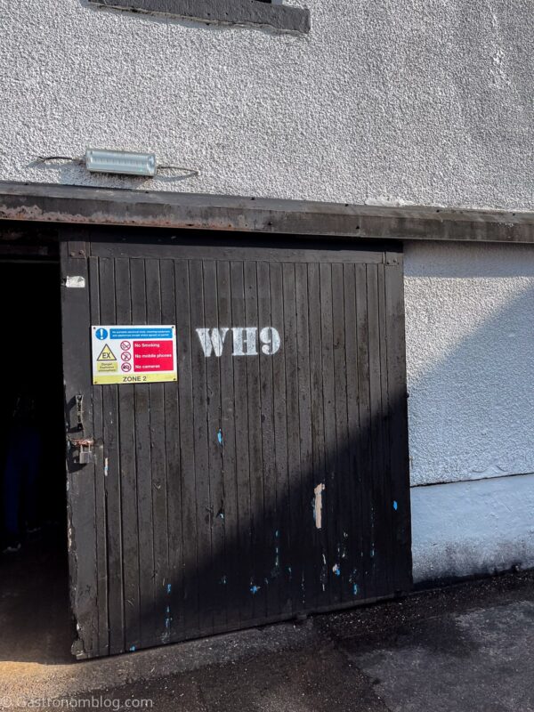 black door of Warehouse 9 on Bunnahabhain Distillery Tour