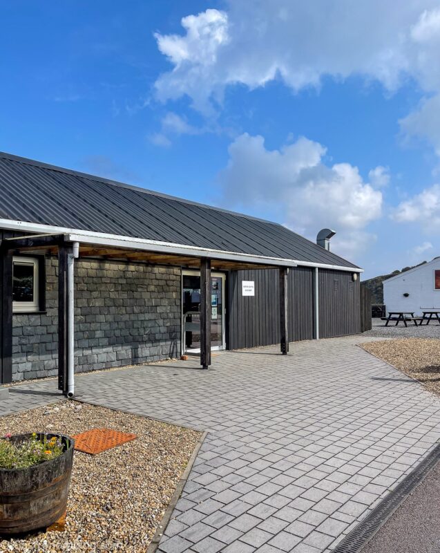 black building that is the tasting room at Bunnahabhain Distillery