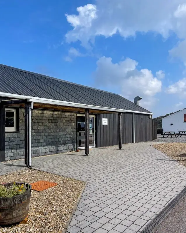 black building that is the tasting room at Bunnahabhain Distillery