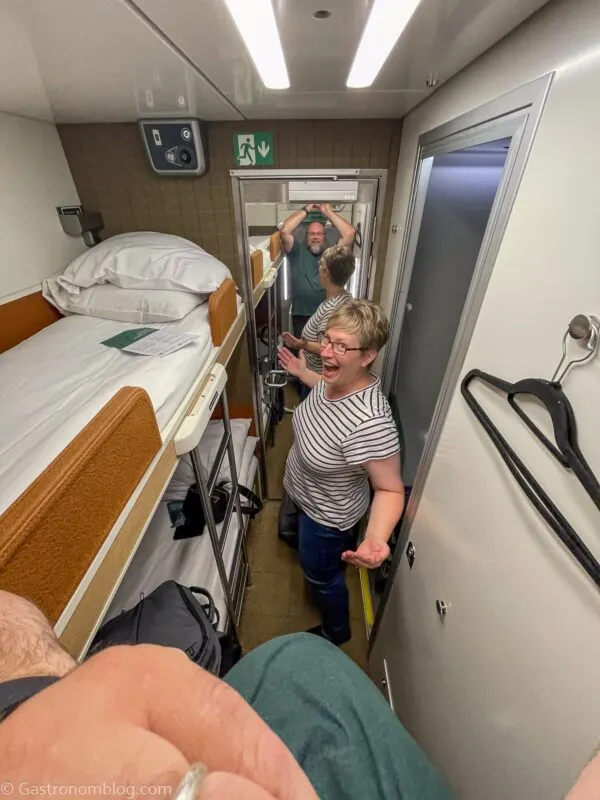 overhead shot of man and woman in cabin on Caledonian Sleeper Train
