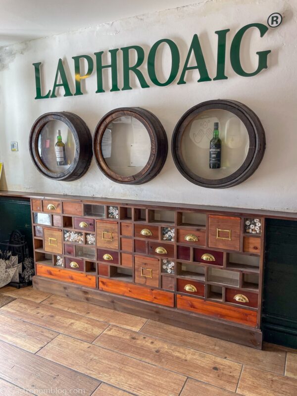 inside gift shop with wooden shelves at Laphroaig Distillery